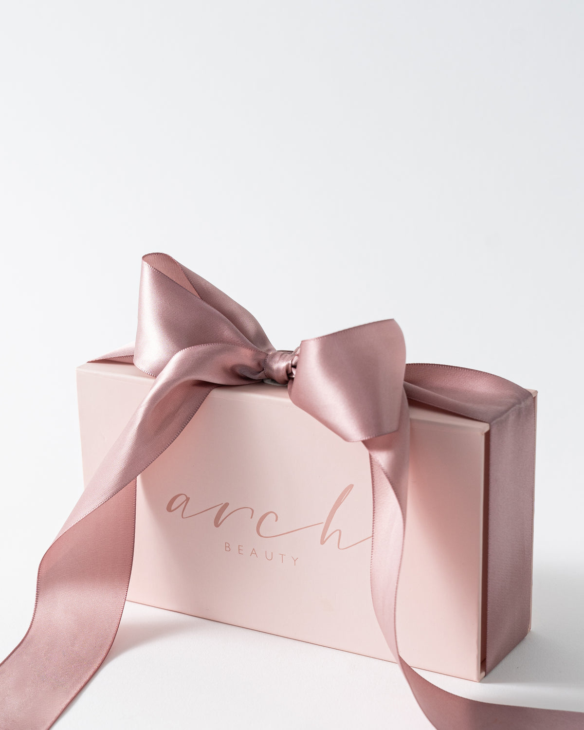 Arch Beauty box with a bow